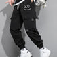 OYOANGLE Men's Cargo Pants Drawstring Elastic Waist Flap Pocket Casual Street Pants Black L